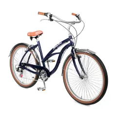 Donkerblauwe beach cruiser fiets met bruin zadel en handvatten, klaar voor een ritje langs de kust.