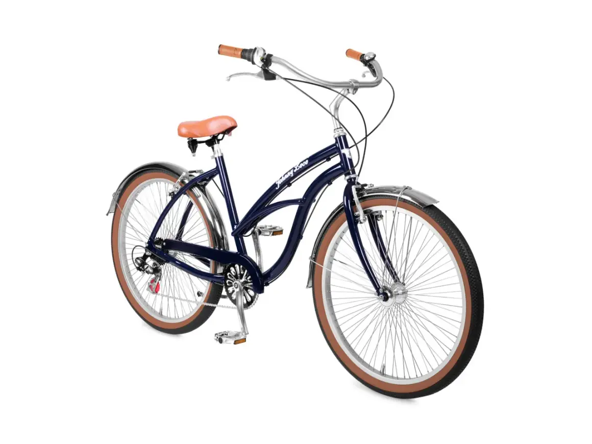 Donkerblauwe beach cruiser fiets met bruin zadel en handvatten, klaar voor een ritje langs de kust.