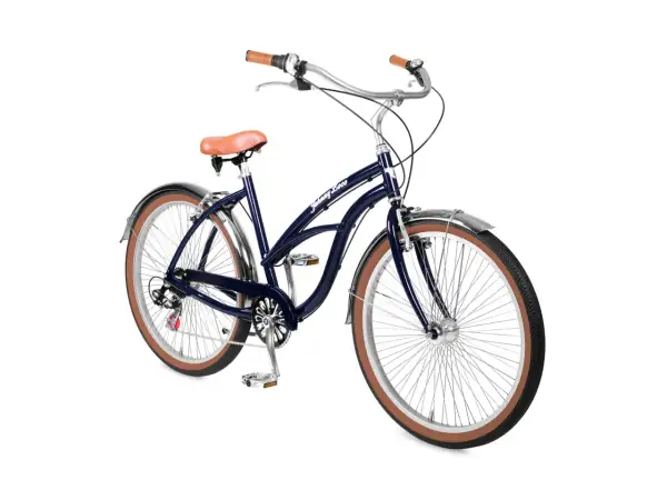 Donkerblauwe beach cruiser fiets met bruin zadel en handvatten, klaar voor een ritje langs de kust.
